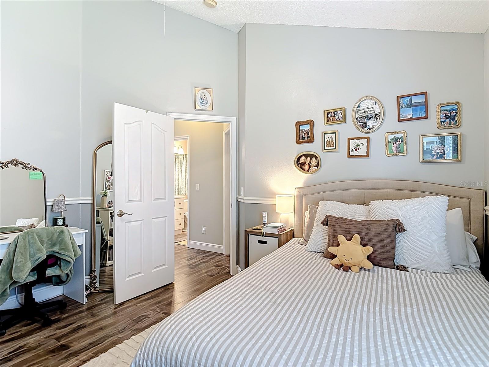 Generously sized Bedroom 3 feature vaulted ceilings, and a walk-in closet.