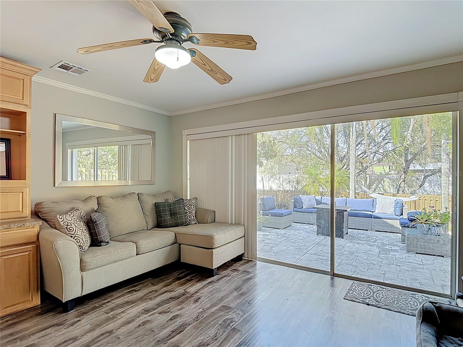 The office is conveniently located off the main living area and offers sliding glass doors leading to the backyard and open patio — ideal for working from home or easily converting into a fourth bedroom.