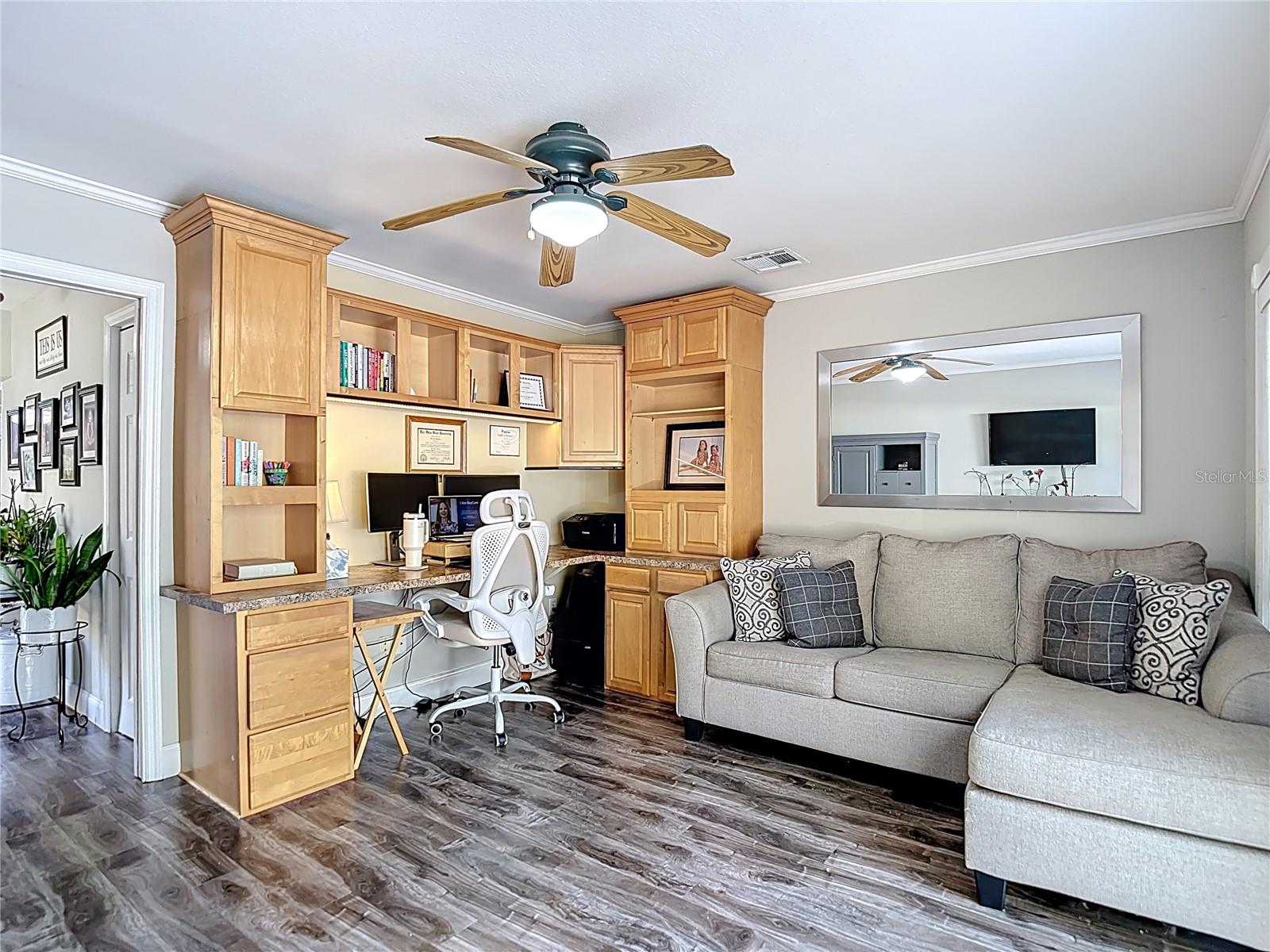 The office is conveniently located off the main living area and offers sliding glass doors leading to the backyard and open patio — ideal for working from home or easily converting into a fourth bedroom.