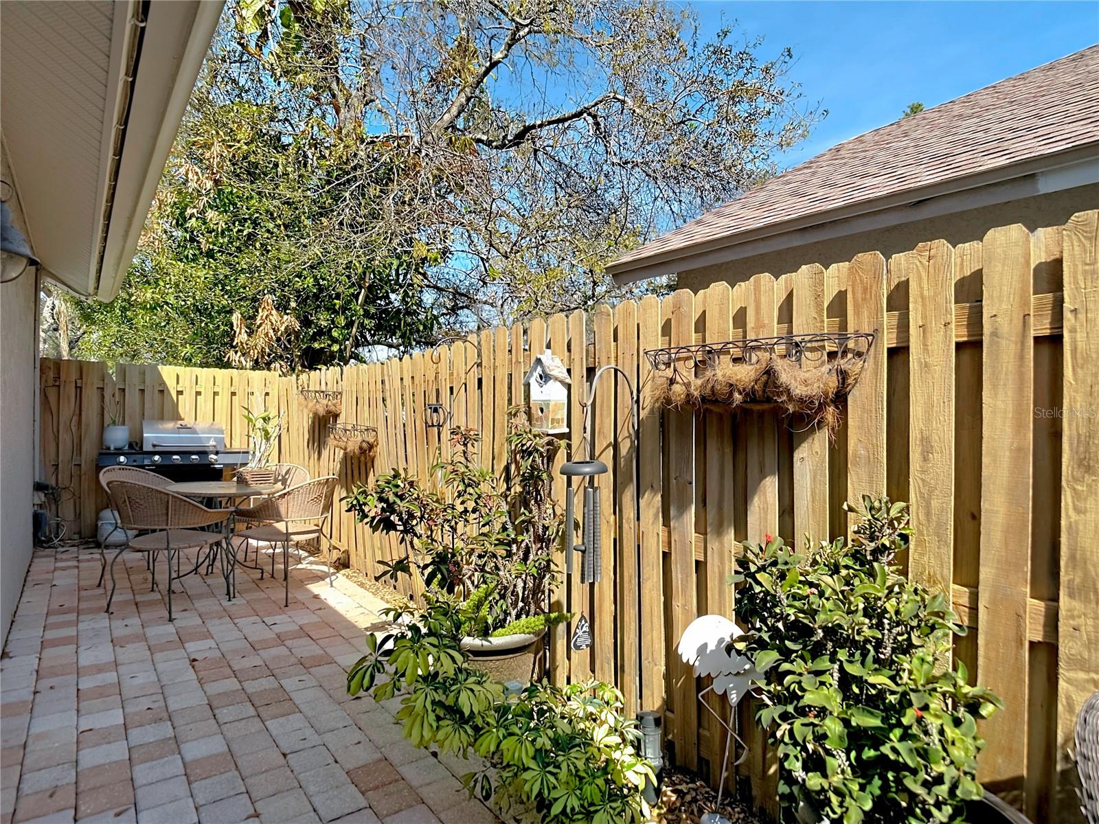 Enjoy the back & side patio for your morning coffee and the newly poured back patio (2024), perfect for gatherings and outdoor entertaining.