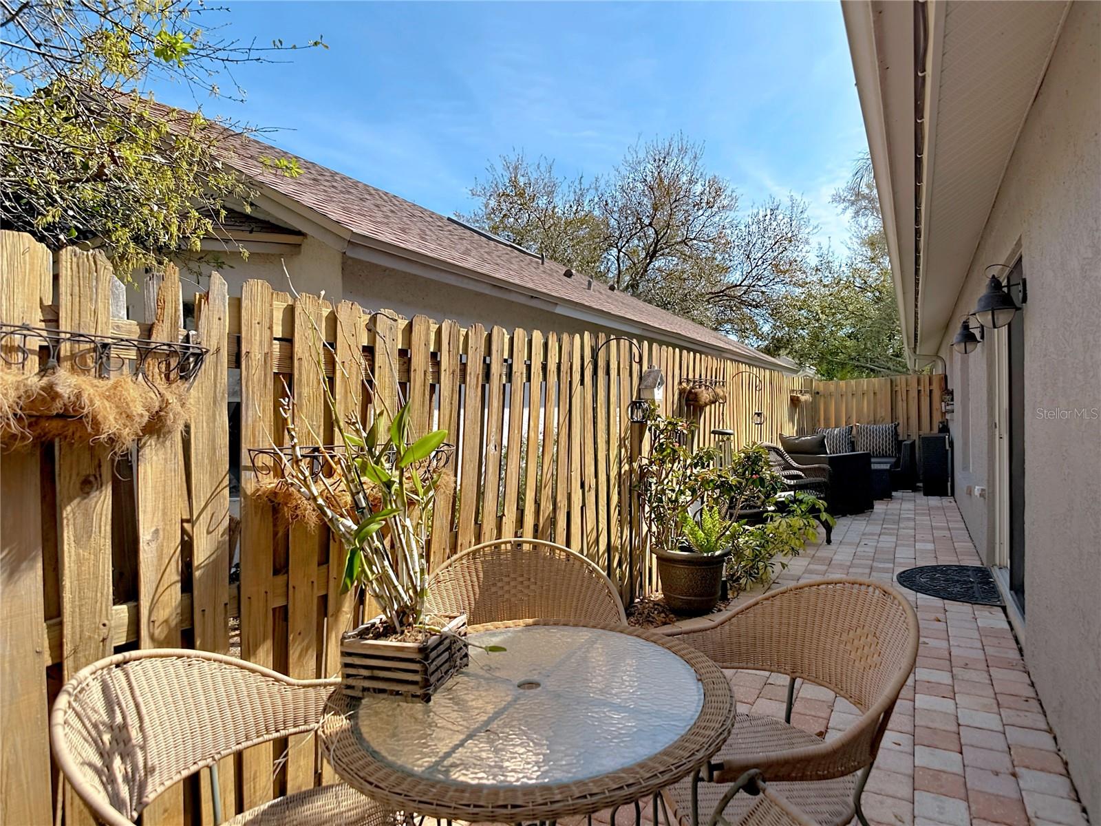 Enjoy the back & side patio for your morning coffee and the newly poured back patio (2024), perfect for gatherings and outdoor entertaining.