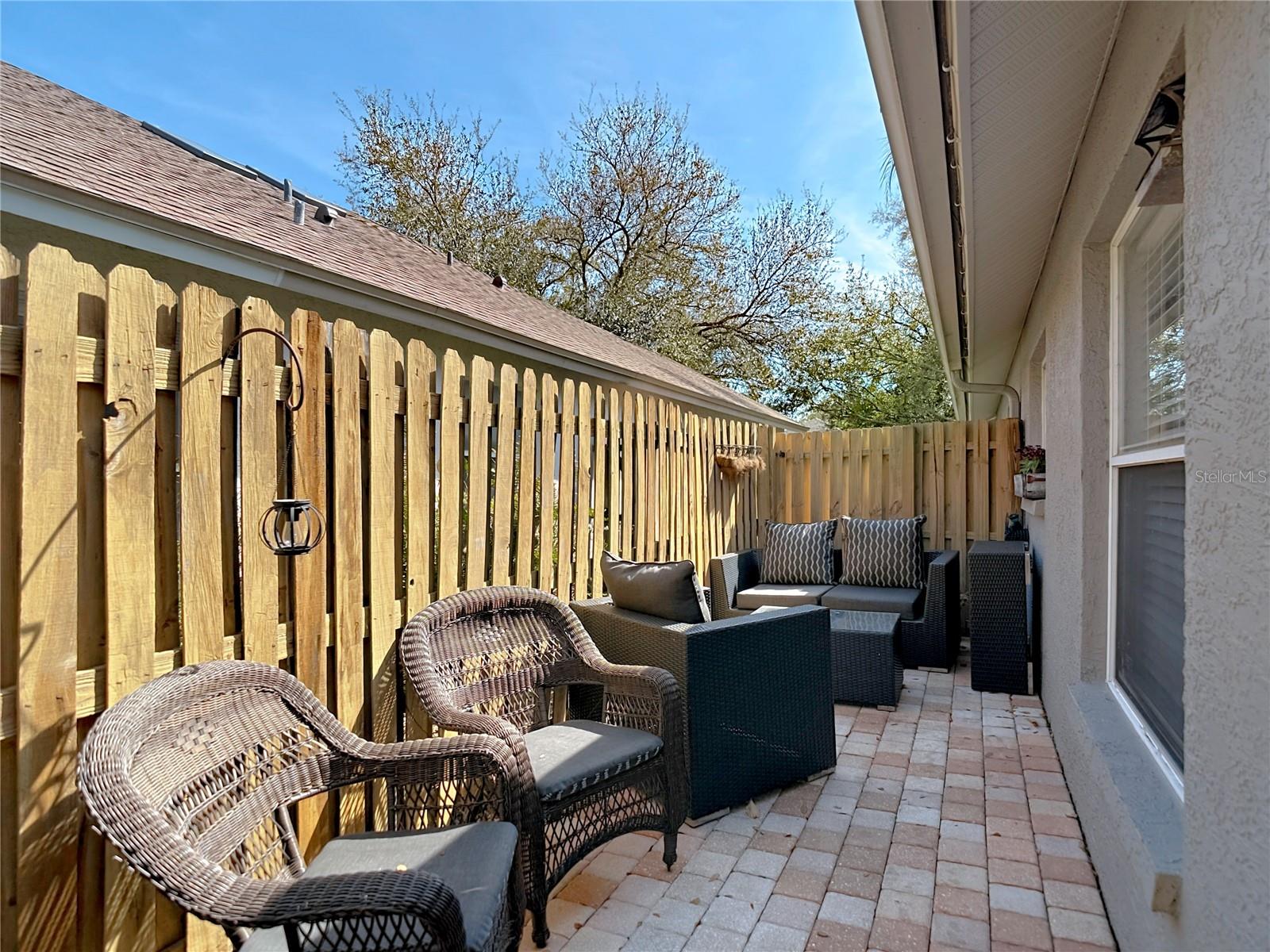 Enjoy the back & side patio for your morning coffee and the newly poured back patio (2024), perfect for gatherings and outdoor entertaining.