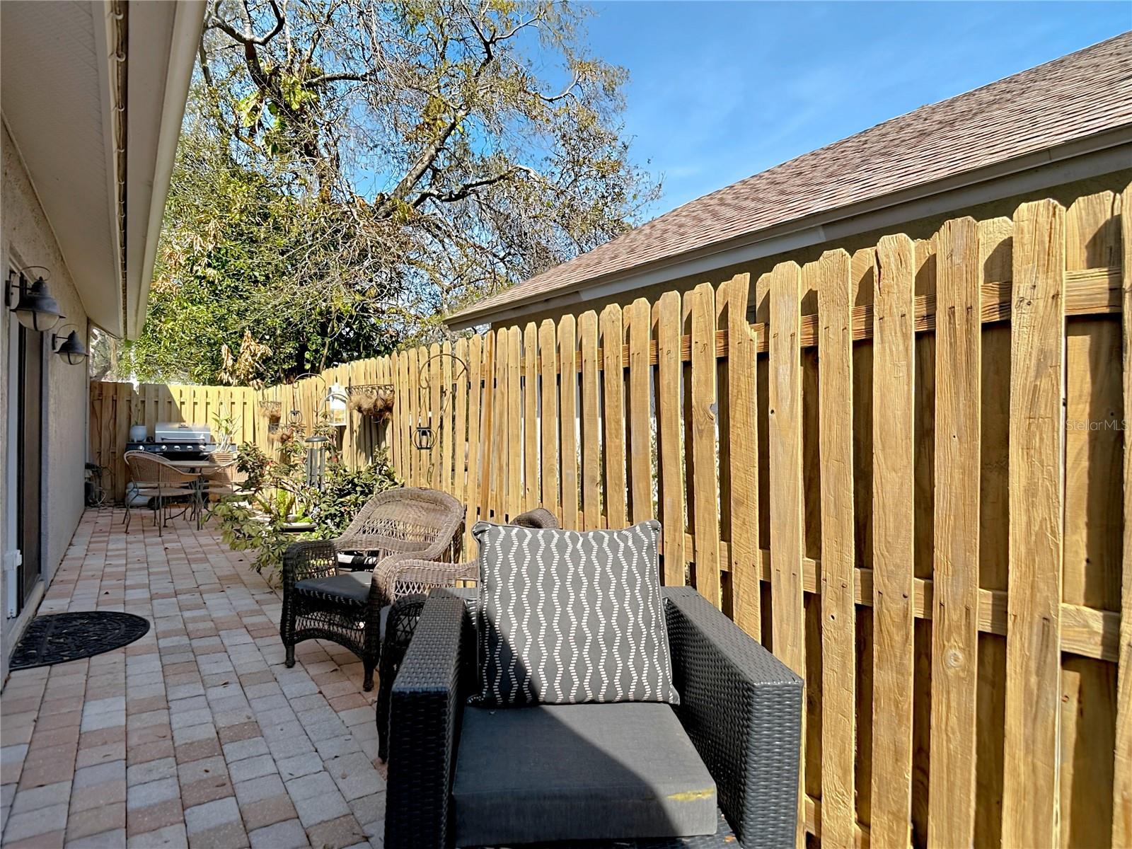 Enjoy the back & side patio for your morning coffee and the newly poured back patio (2024), perfect for gatherings and outdoor entertaining.