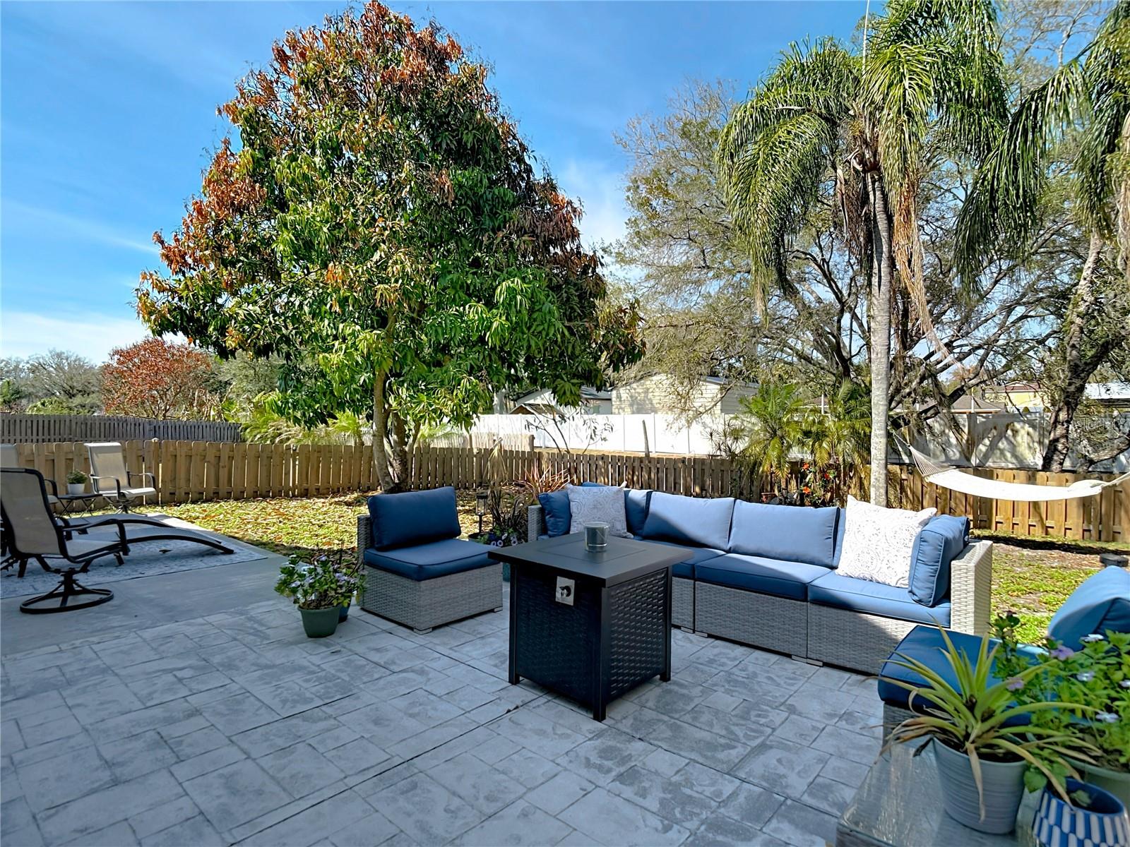 Enjoy the back & side patio for your morning coffee and the newly poured back patio (2024), perfect for gatherings and outdoor entertaining.