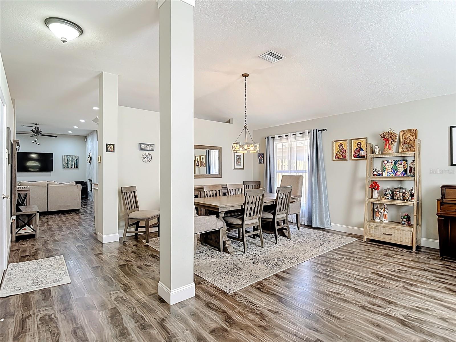 Upon entry, you’re welcomed by formal living and dining rooms — perfect for entertaining.