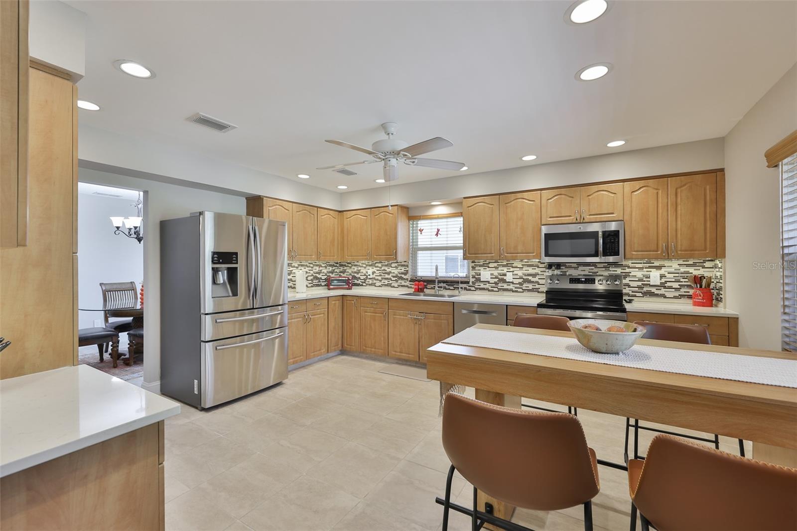 Sparkling clean and modern, the kitchen is HUGE.