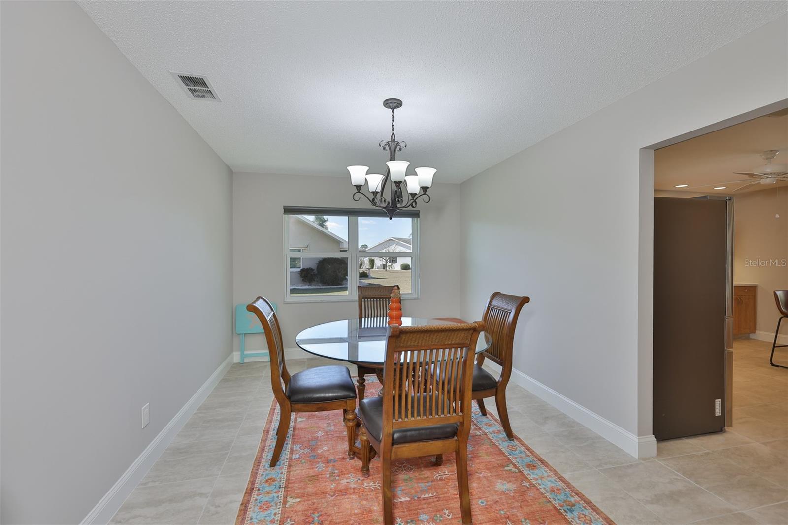 The dining area is bright and well proportioned for multiple guests or intimate meals.
