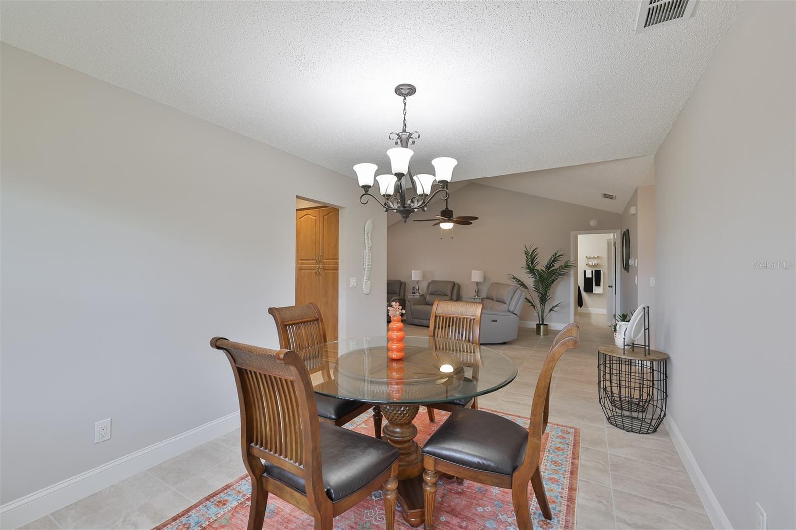 Again, the open floor plan accentuates the comfortable living style of this home. Notice the high base boards and beautiful flooring.