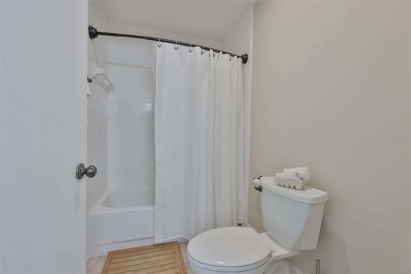 Primary shower w/Tub and toilet are in their own private space.
