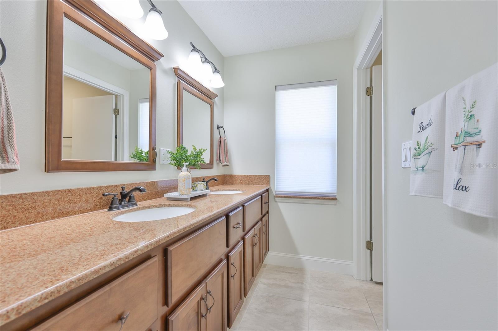 The guest bath has also been updated with contemporary counters, cabinetry and fixtues.