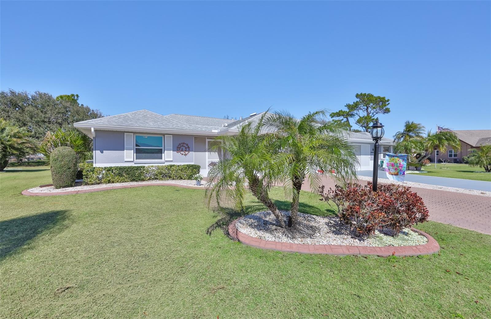 Customer curbing and simple, easy maintenance landscaping surrounds the home.