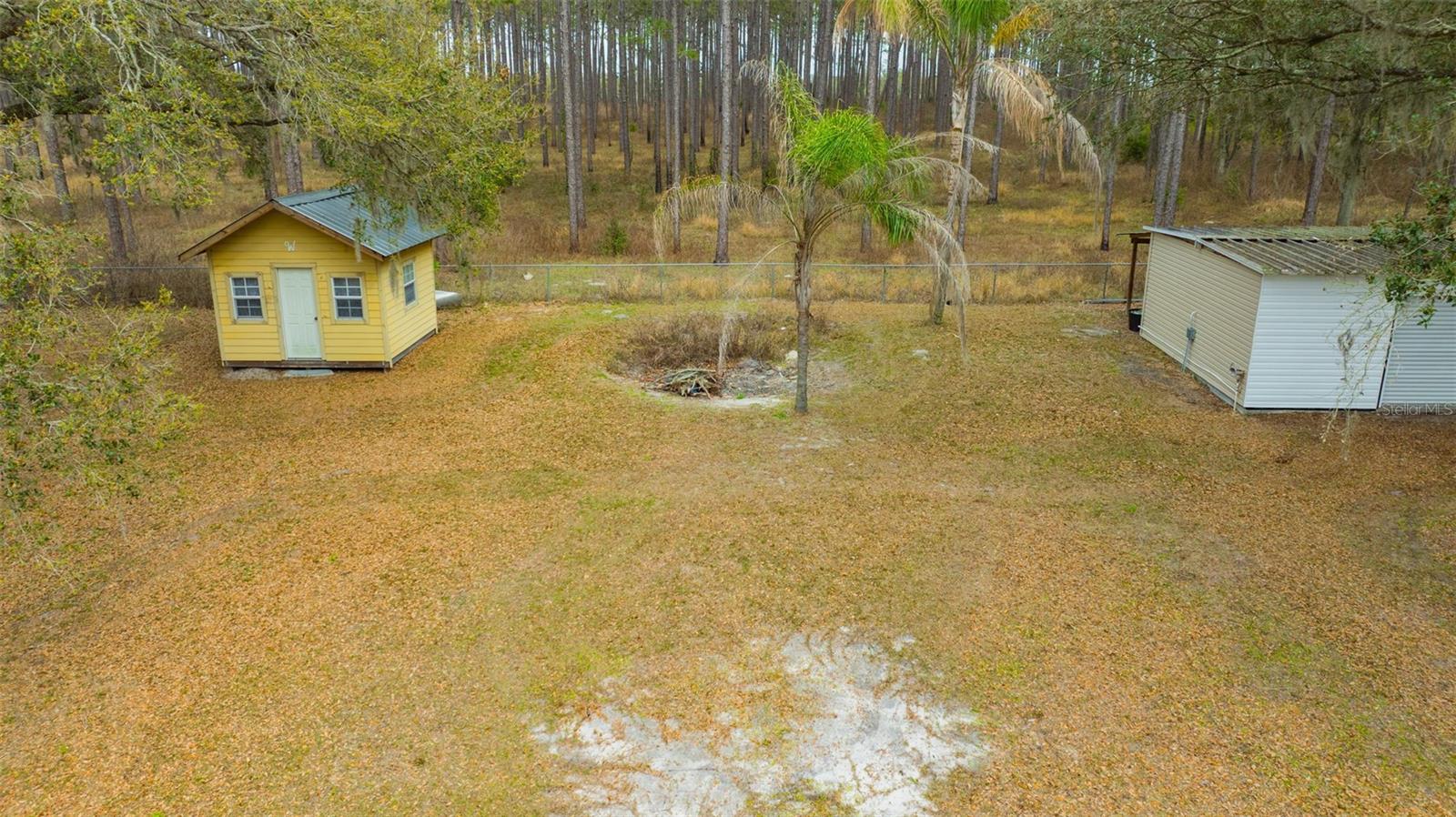 Backyard with 2 sheds