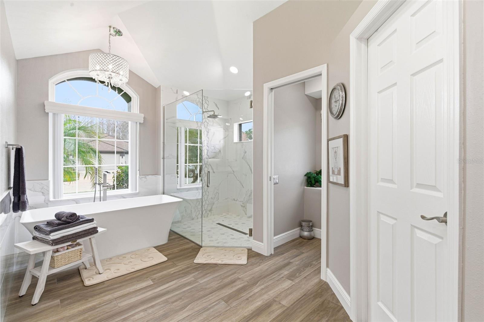 Fully Renovated ensuite offers a separate soaking tub, walk in shower and spacious walk-in closet