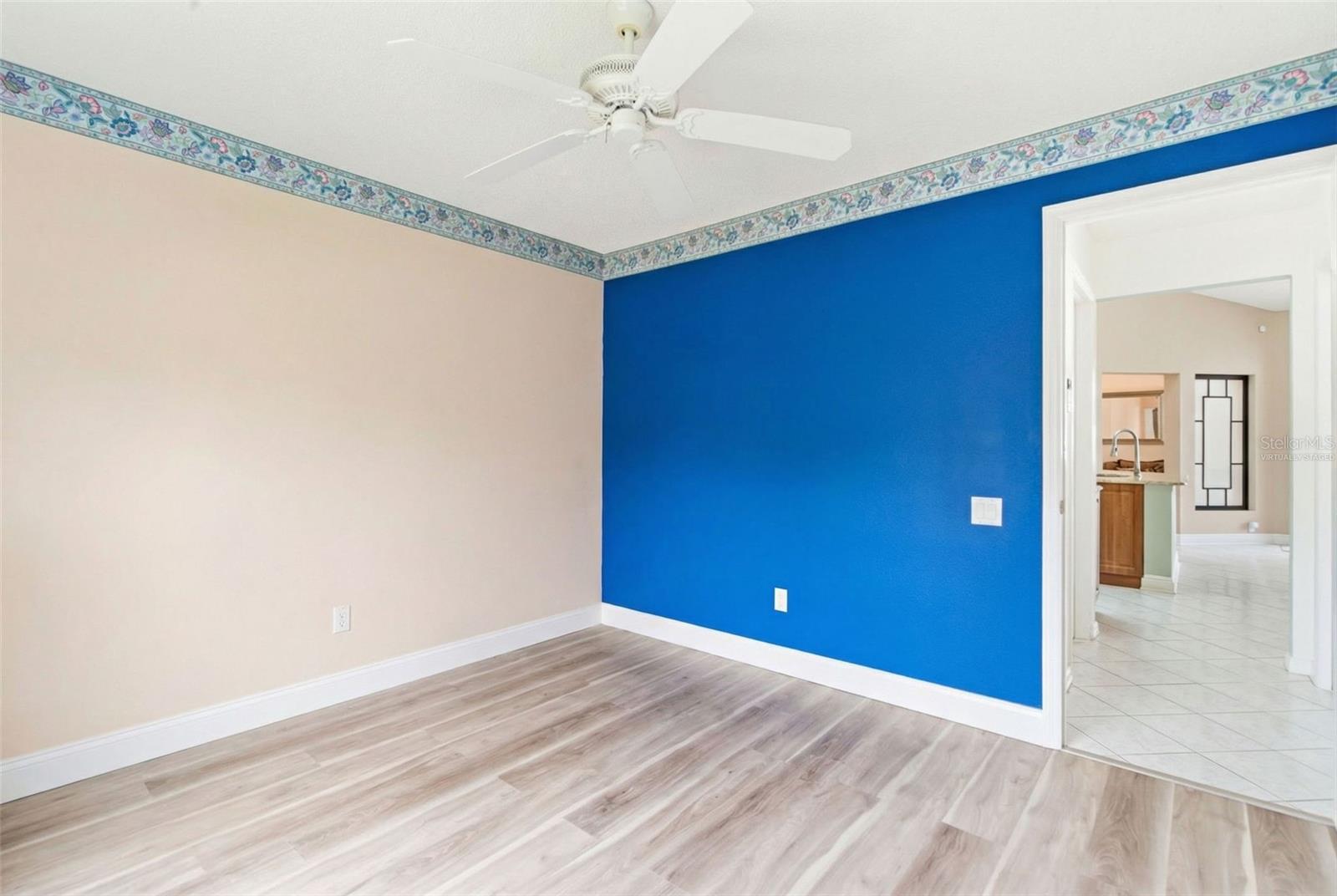 Bedroom 1 with virtual furniture removal for visualization of room size.