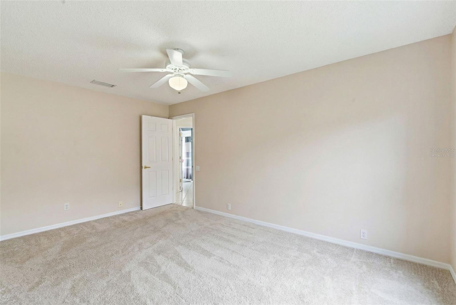 Bedroom 2 with virtual furniture removal for visualization of room size.