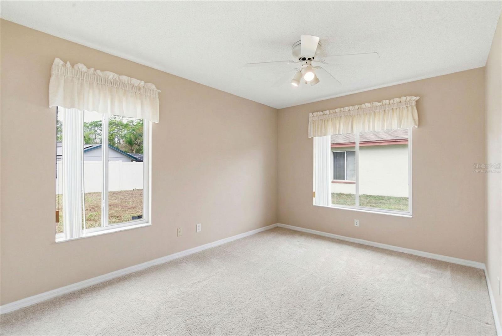 Bedroom 3 with virtual furniture removal for visualization of room size.