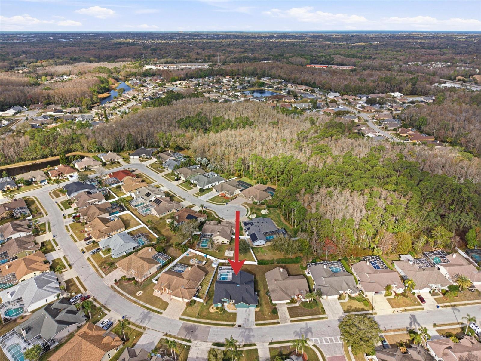 Overhead neighborhood view highlighting the home’s position between the front street and back street.