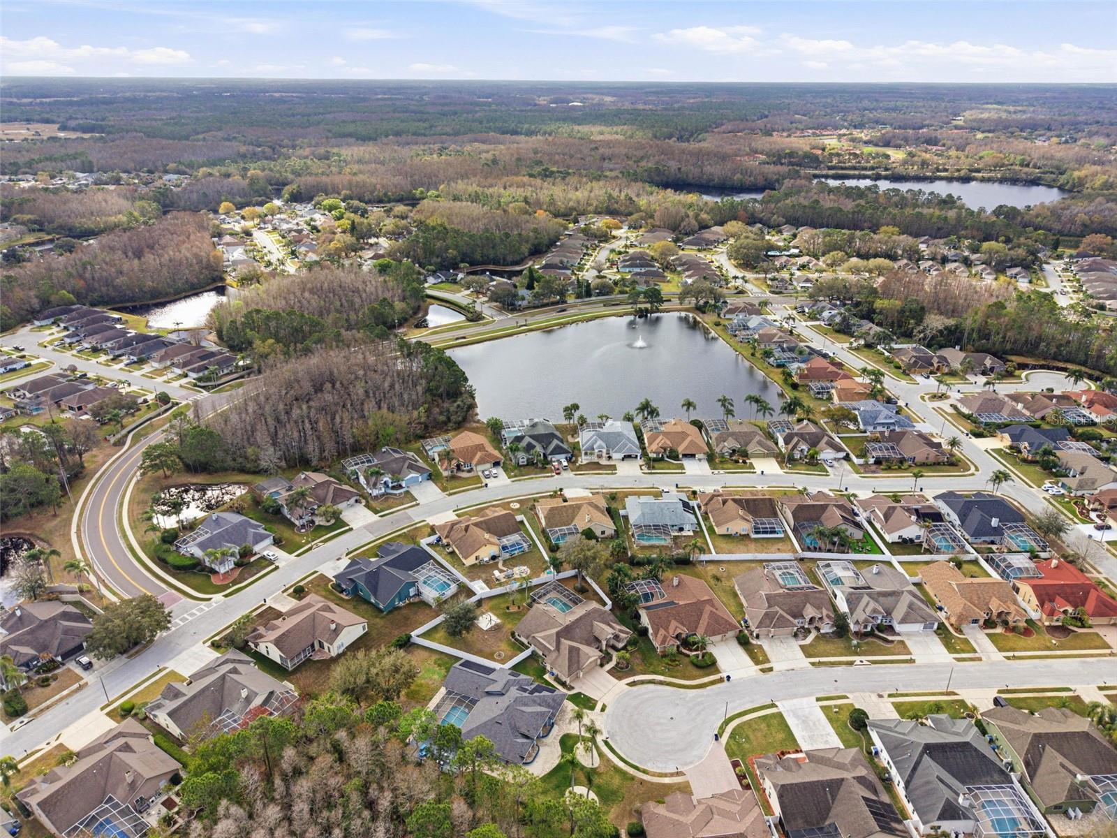 Aerial view of the front, back and side road access.