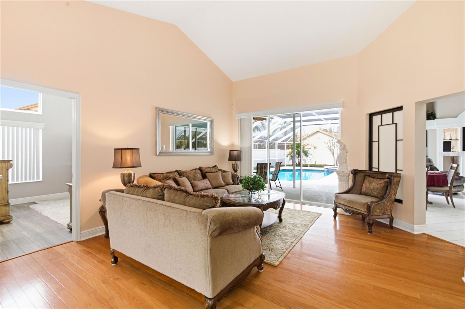 Spacious Family room featuring the seller’s furniture, showcasing the open layout and natural light.