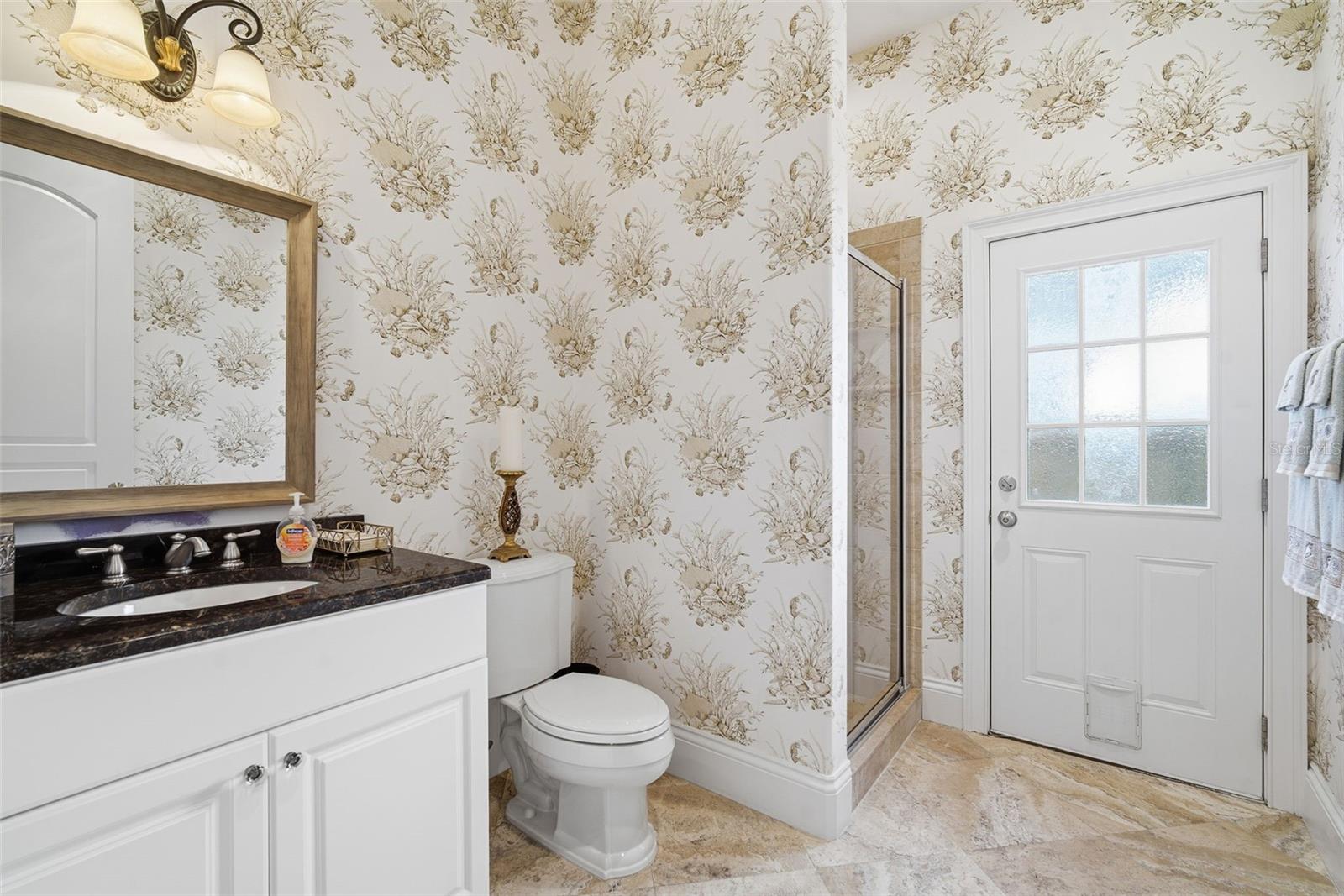 5th bathroom functions as pool bath with also an exterior entry.