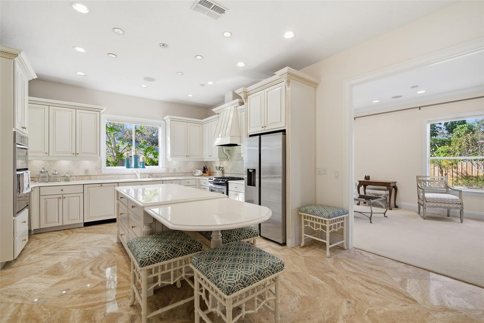 Kitchen, gas range, built-in convection oven, built-in microwave, Travertine flooring, looking into formal living room or reading room