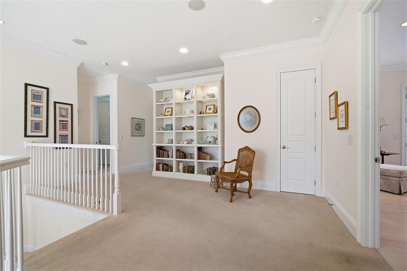 Loft area separating the primary suite from the three other bedrooms.