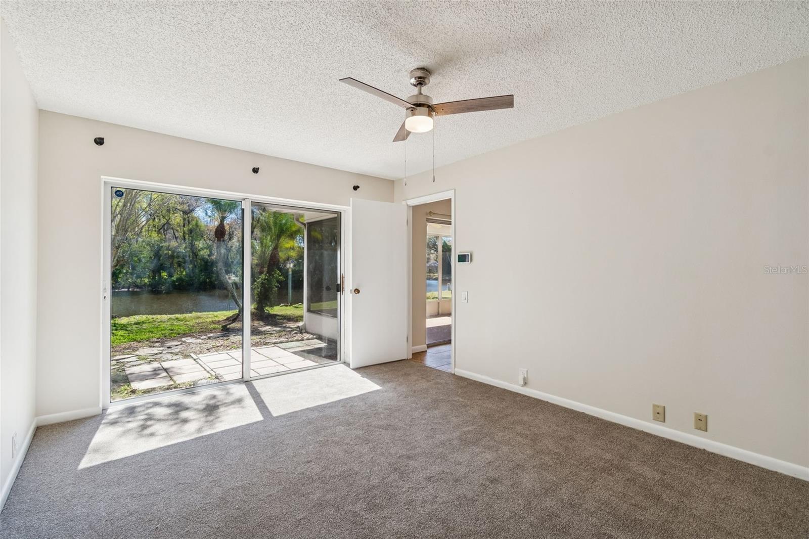 Primary Bedroom w/Sliding Glass Doors to Yard