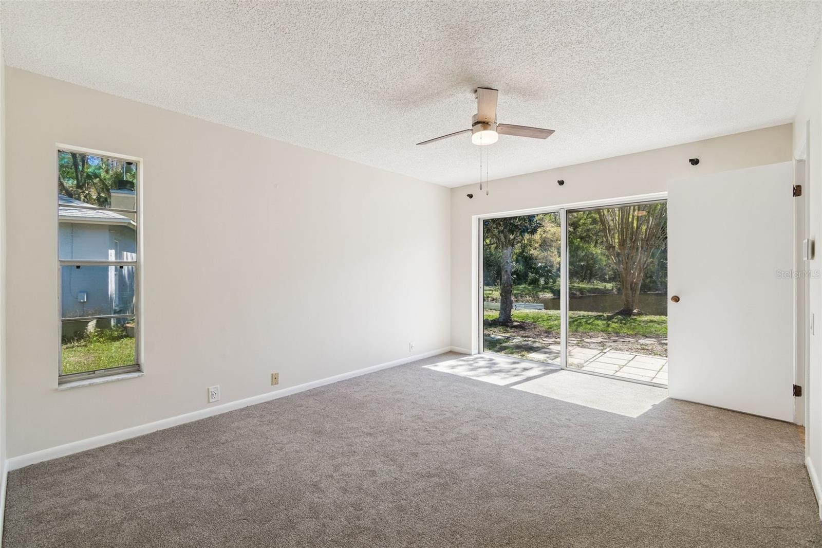 Primary Bedroom w/Sliding Glass Doors to Yard