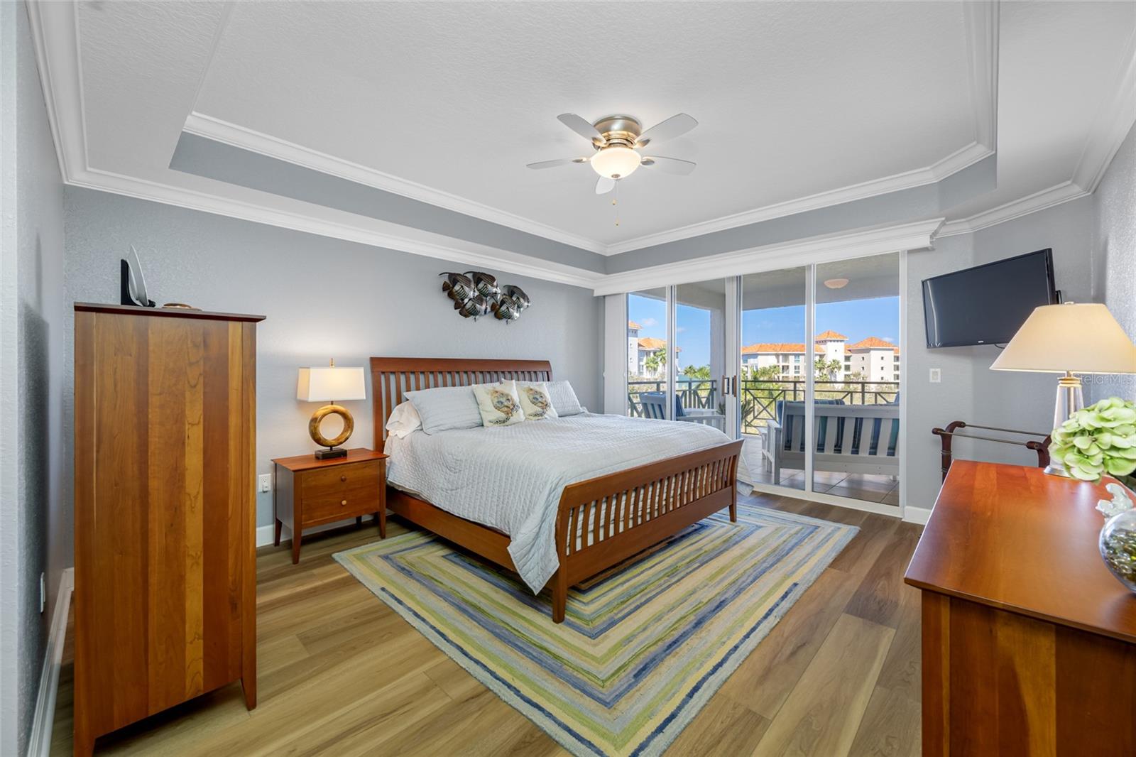Master bedroom with balcony access & views