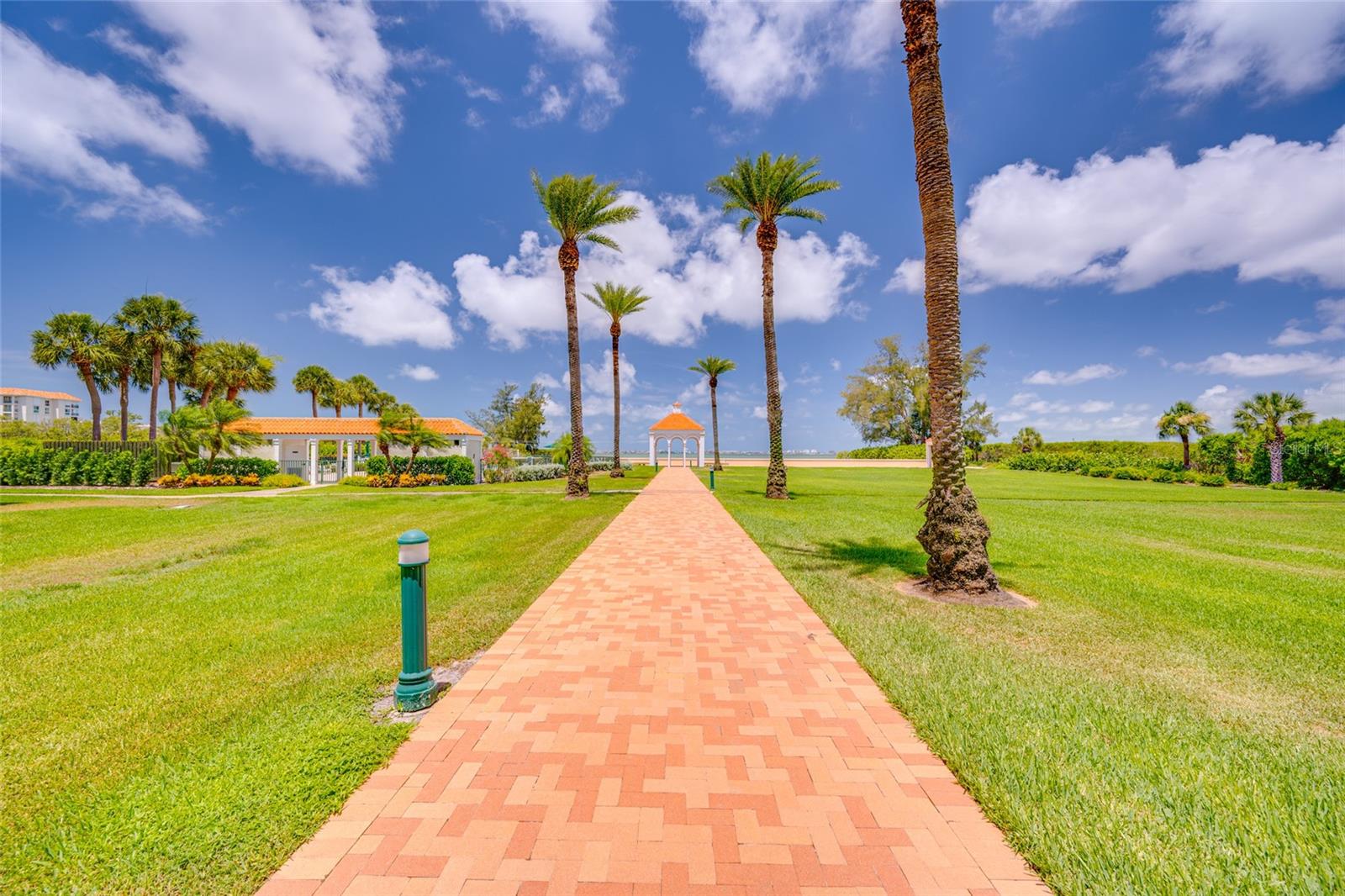Beautiful paved walkway heading toward the Private Beach