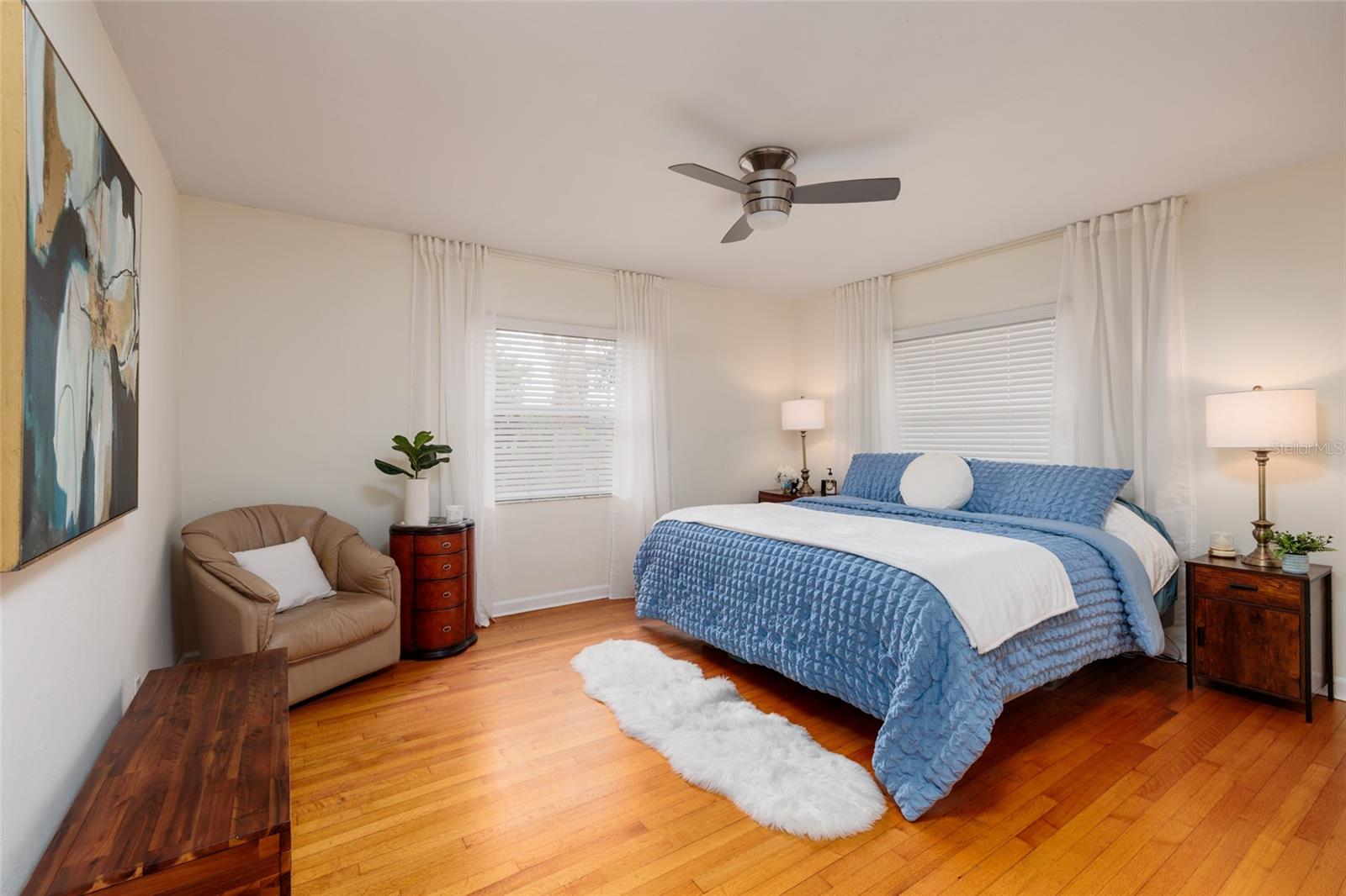 Bedroom 1 with original hardwood floors.