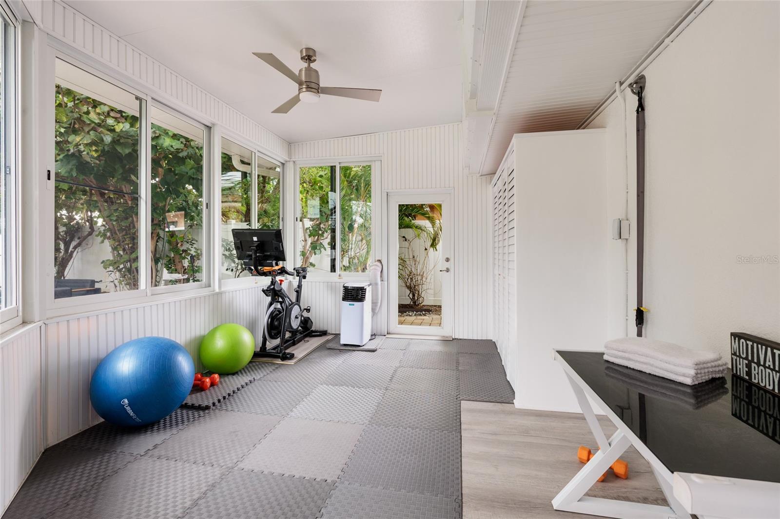 Bonus room (170 Sq. Ft) with panoramic views of the outdoor oasis- firepit and pool oasis. (New 2018)