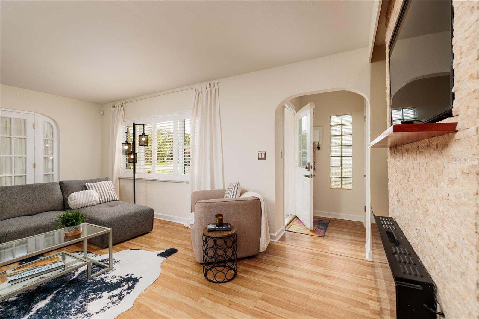 Light and Bright with soft rounded archways , plantation shutters and LuxVT flooring (2024) throughout main living area.