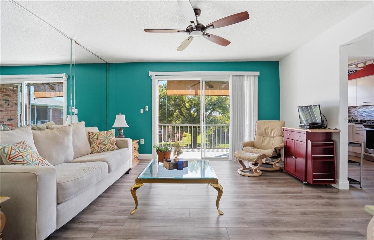 View upon entering of living room thru sliding doors to balcony.