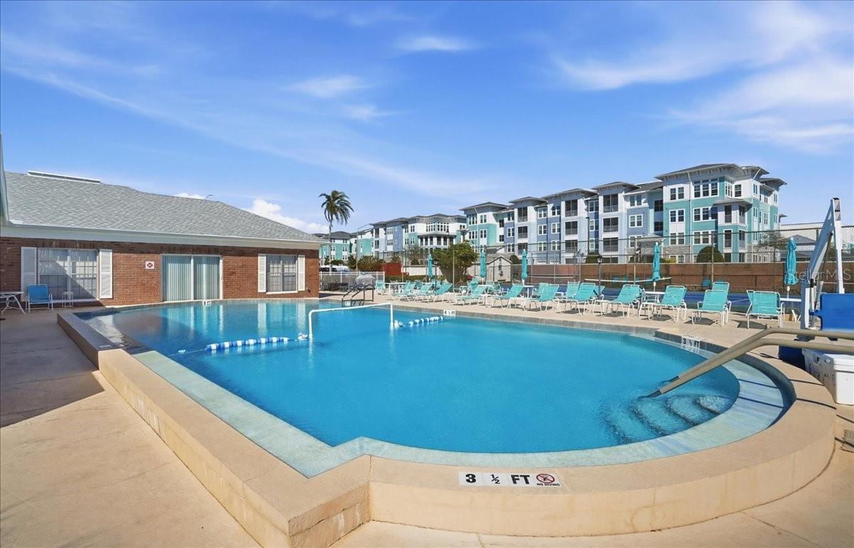 Clubhouse back left of pool includes kitchen, library, saunas, and laundry roon.