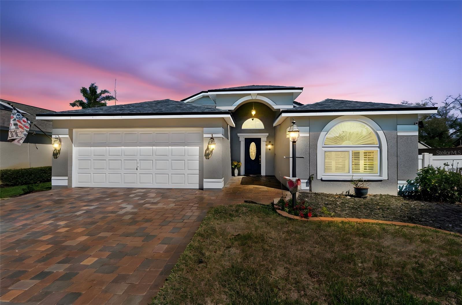 Enjoy the freshly installed pavers and exterior painting.