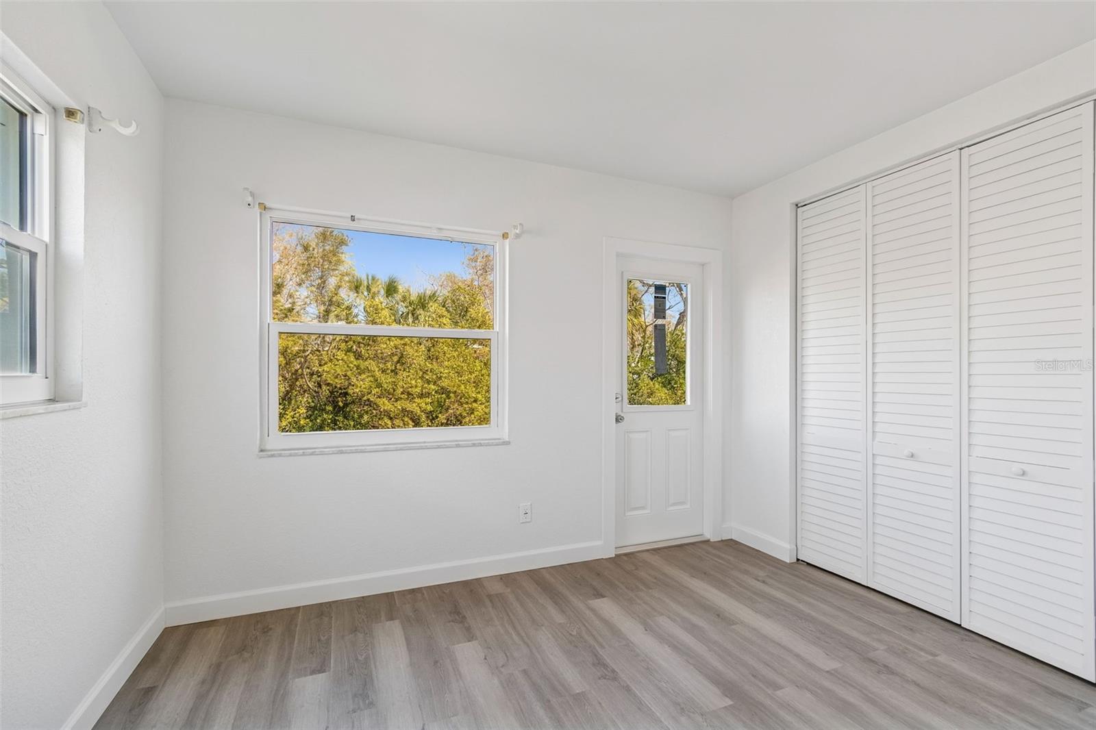 Office Sitting Room with built in closet and door to patio