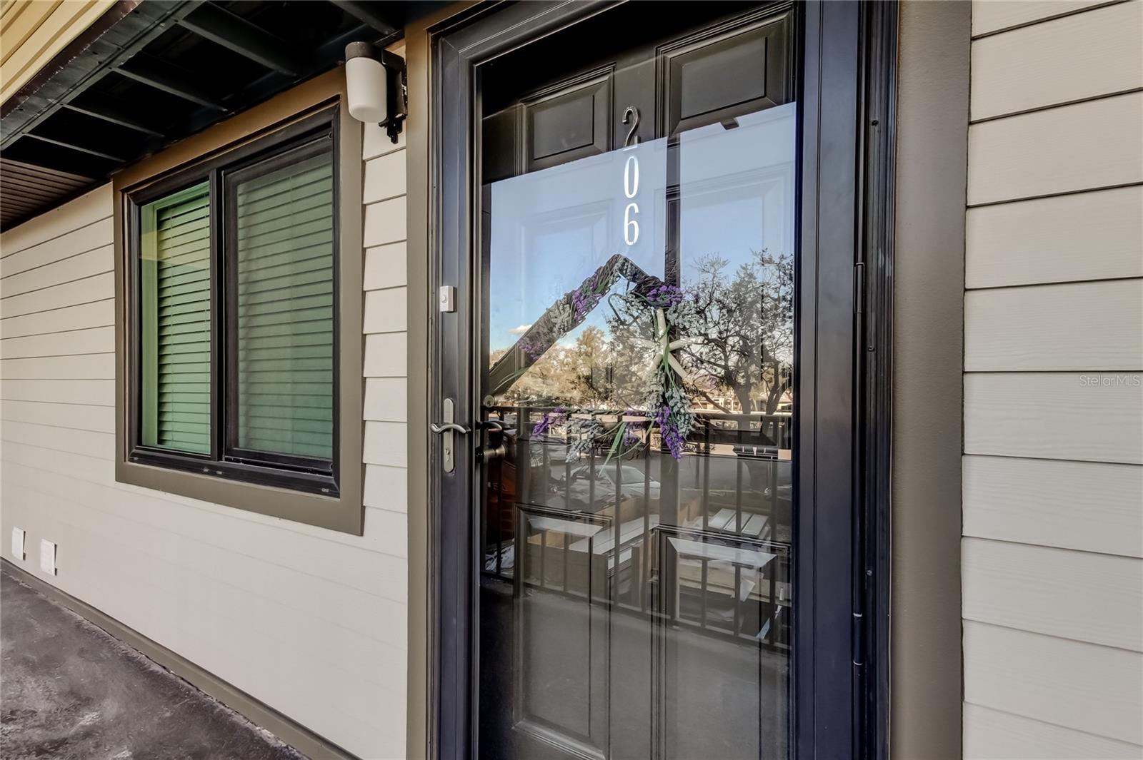 Enter through the storm door and front door to your next home.