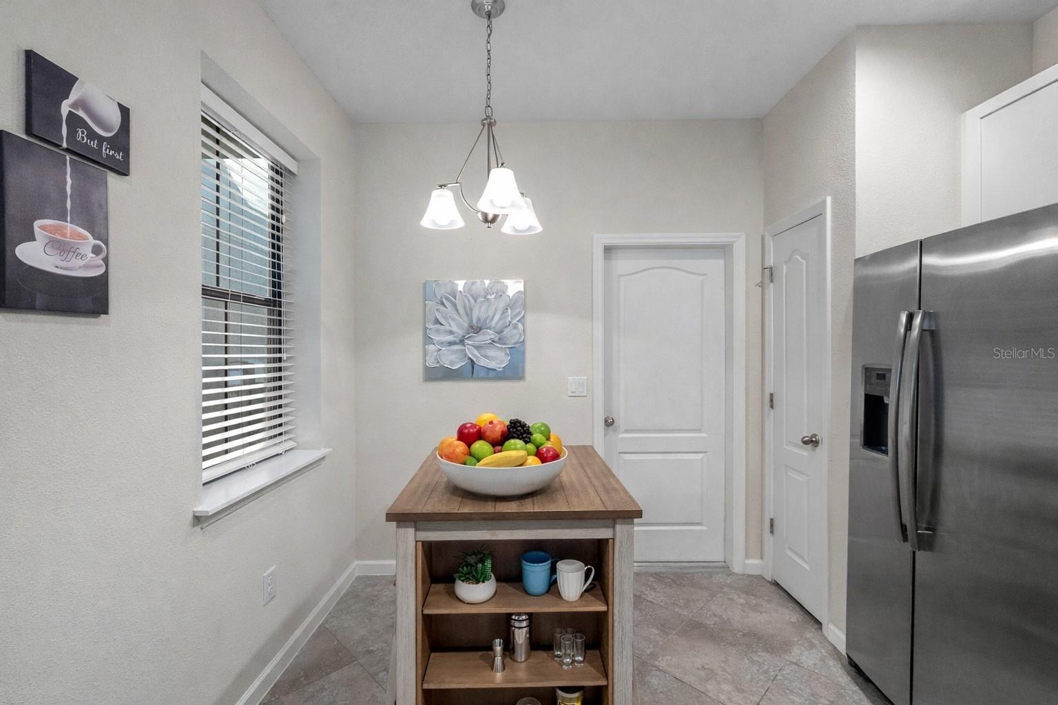 Functional kitchen layout with ample counter space and easy access to the garage—perfect for unloading groceries.