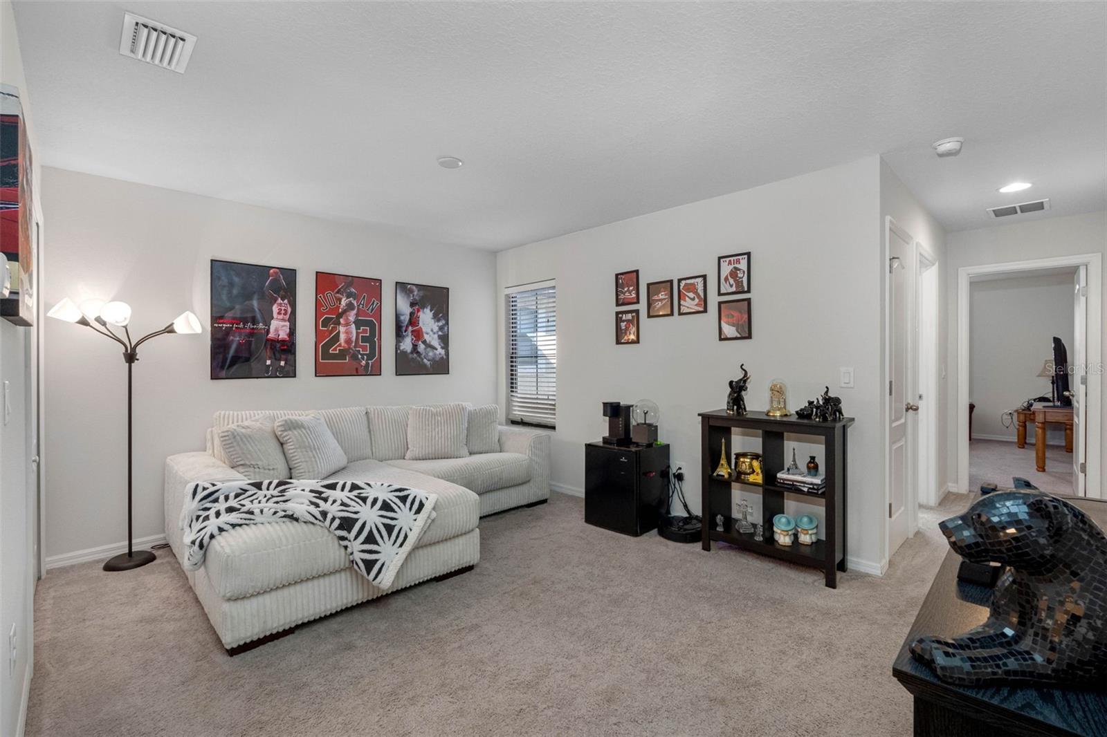 Versatile loft space ideal for a home office, second living area, or third sleeping space with a pull-out sofa.