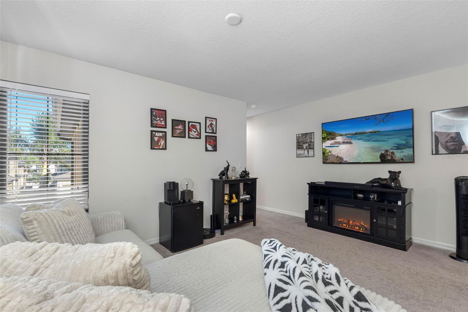 Versatile loft space ideal for a home office, second living area, or third sleeping space with a pull-out sofa.