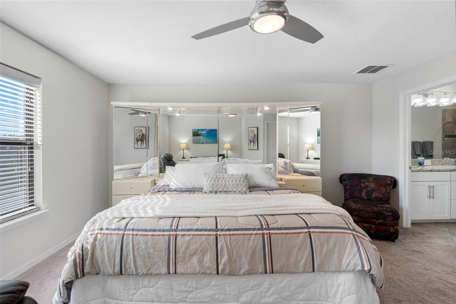 Spacious primary suite offering comfort, privacy, and room for a king-size bed.