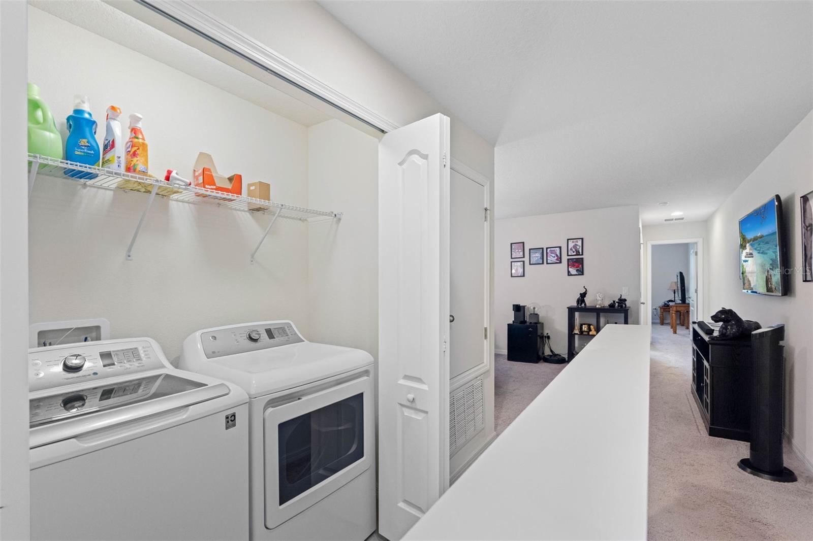 Upstairs laundry closet for everyday convenience—no stairs required.