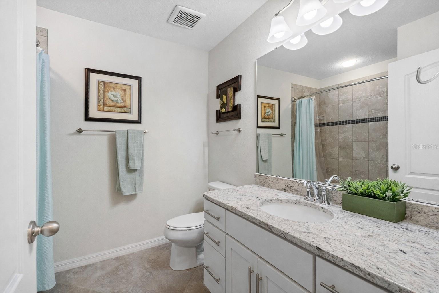 Full hallway bathroom serving the second bedroom and loft area.