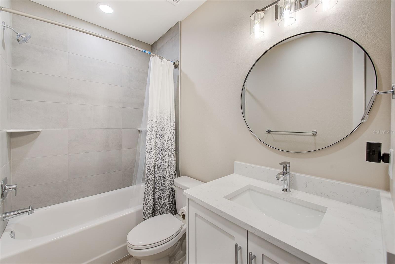 Bathroom 3 with quartz counters.
