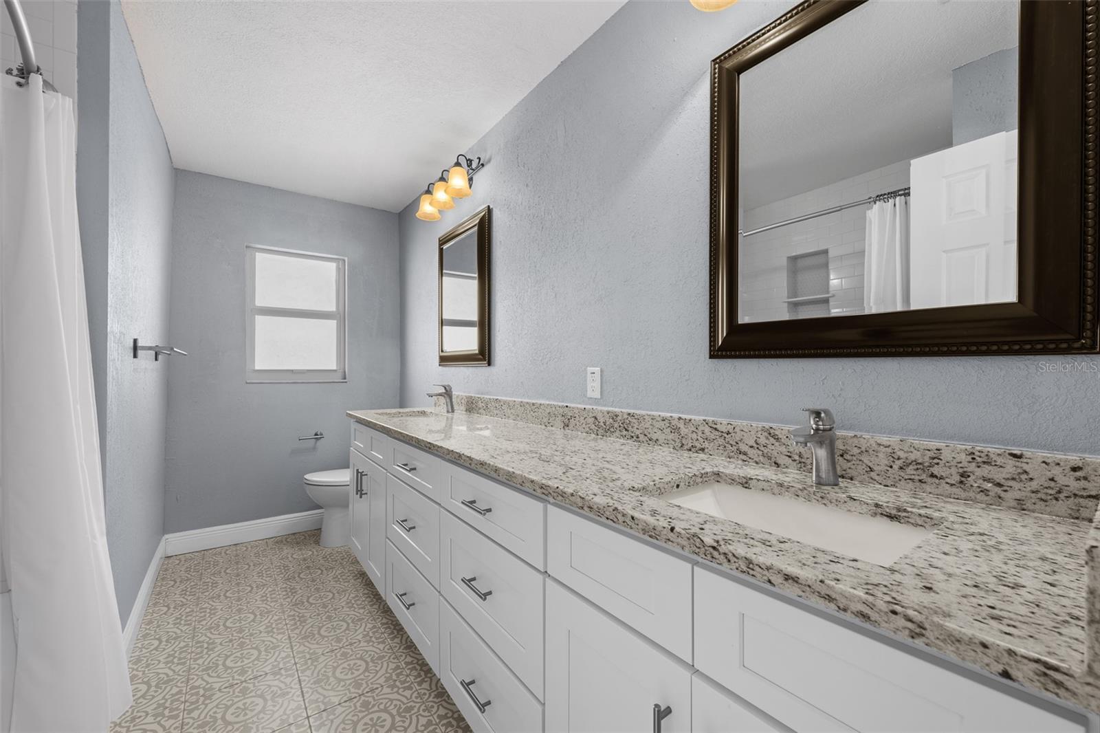 Second bathroom with dual sinks