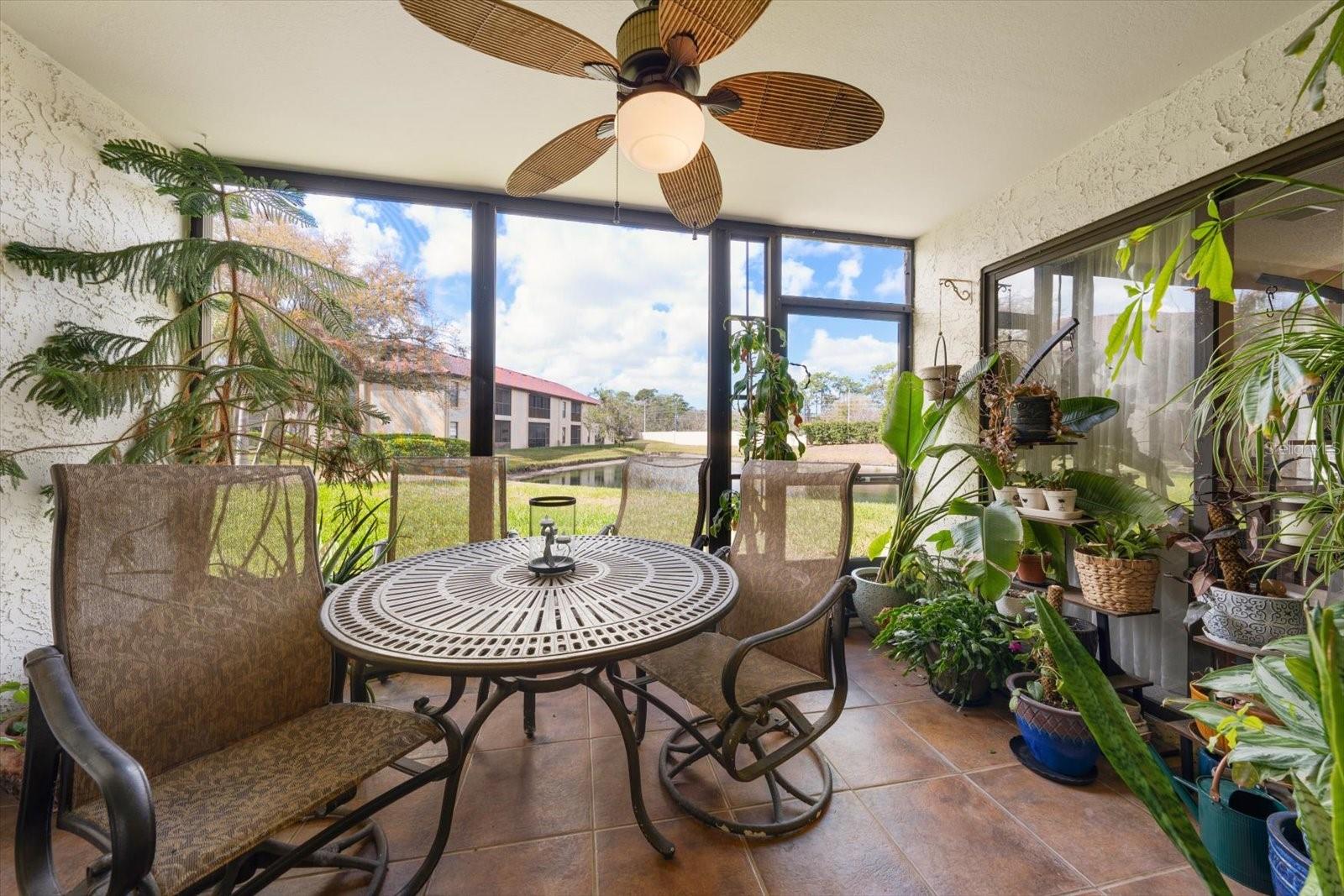 Screened-In Back Porch over looking pond.
