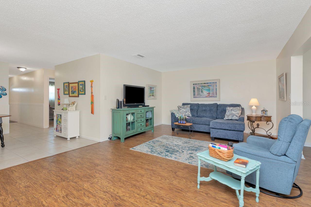 Living room, sofa and recliner chair stay with property