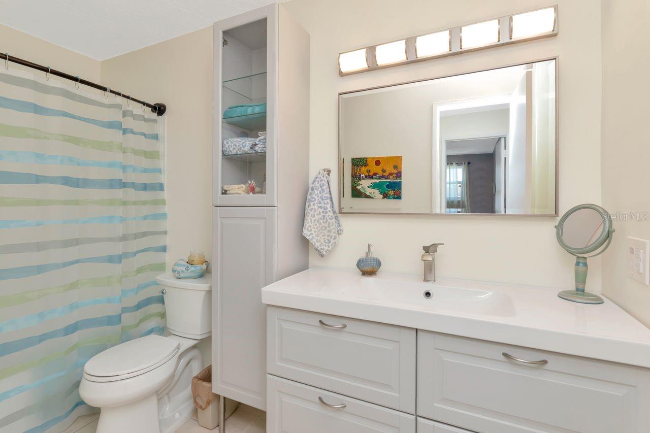 Bathroom with tub and plenty of cabinet space