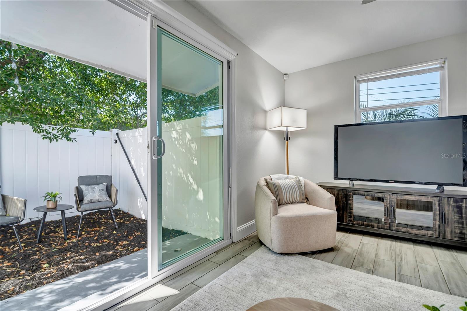 Tinted sliders to patio with black out shade